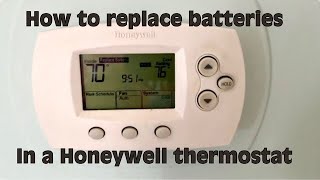 How to replace the AA batteries in a Honeywell Thermostat [upl. by Thorsten]